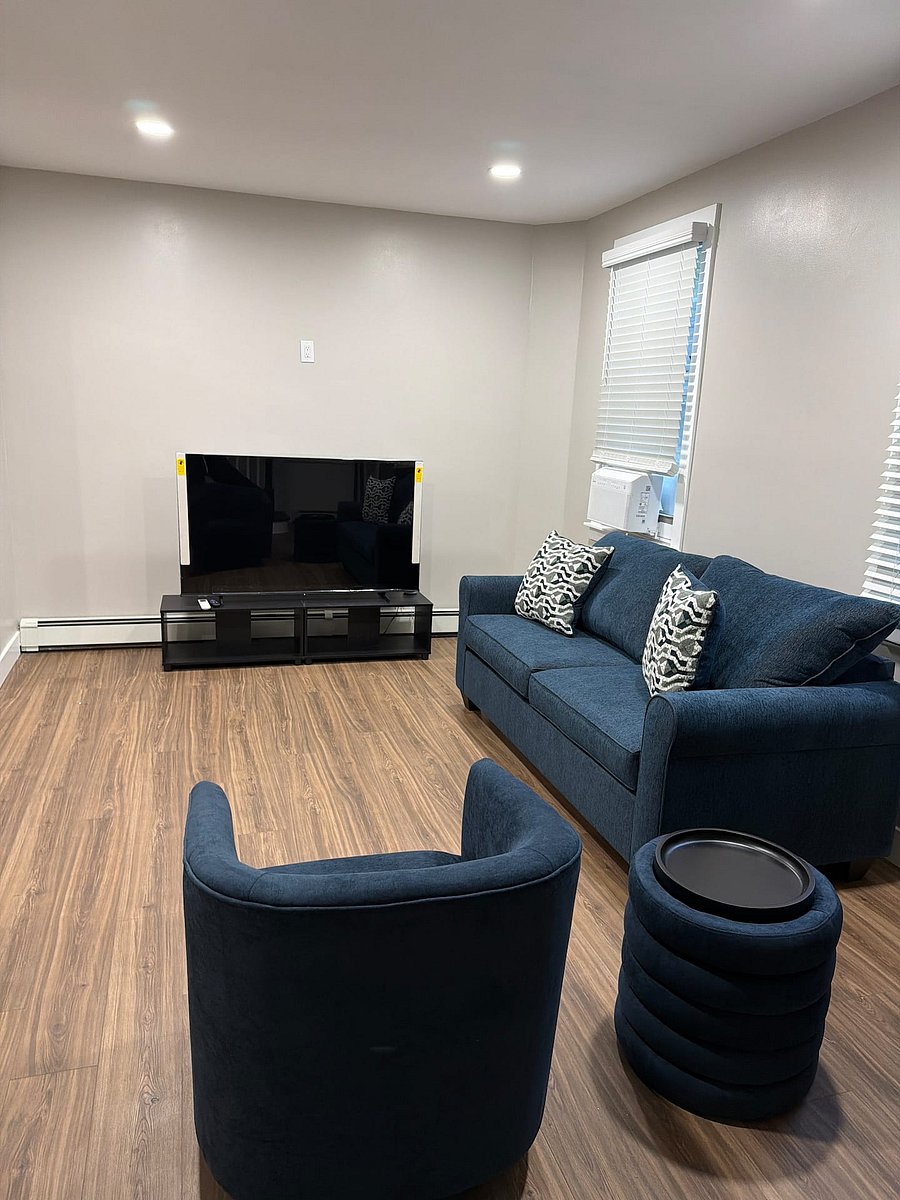 Spacious living room with smart TV and all new furniture.