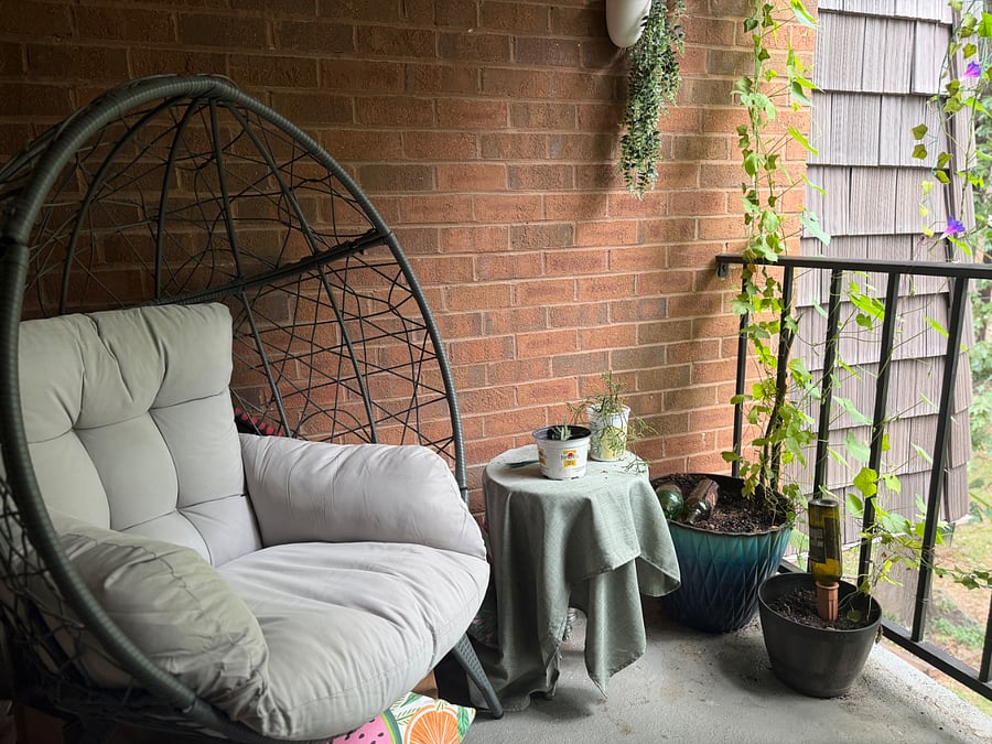 Balcony overlooking courtyard greenery and gardens