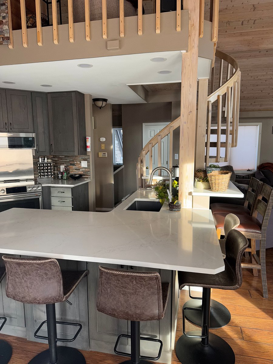kitchen and spiral stairs to loft