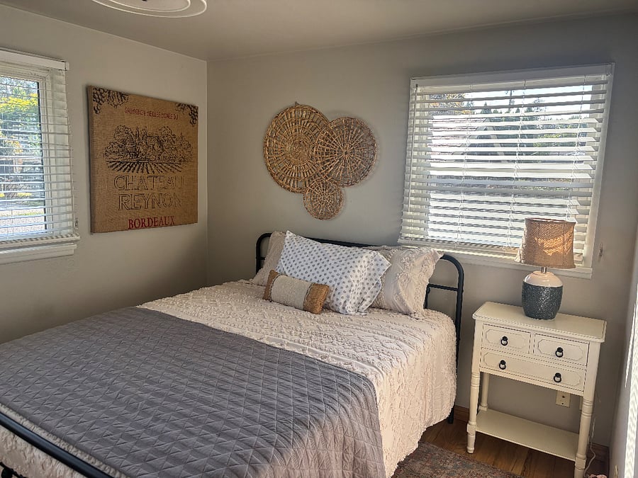 Bedroom has queen sized bed with plenty of closet space