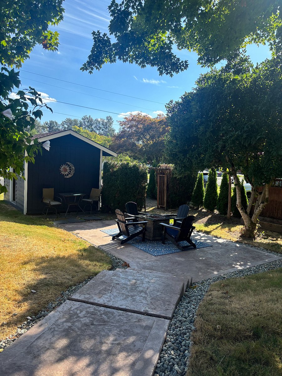 Gas firepit is located in a private area under a beautiful tree