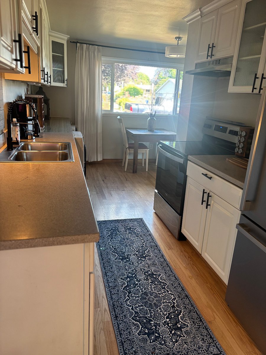 Countertops are Corian and stainless steel sink with updated sink