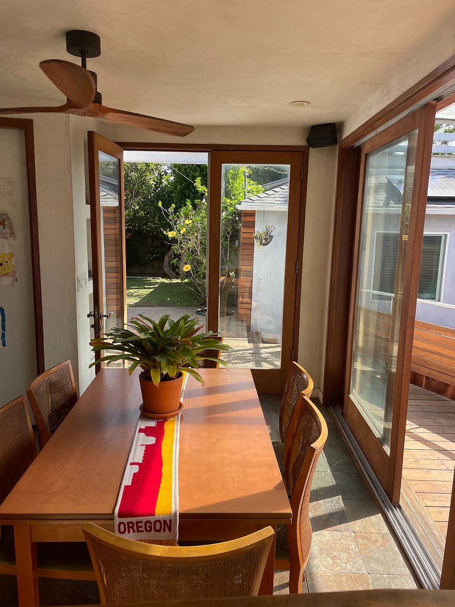 Dining area with sliding doors that open to the gardenM<