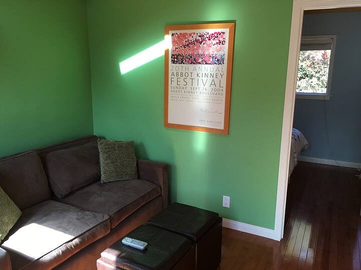 Sitting area, office, and theatre (projector, and projection wall).