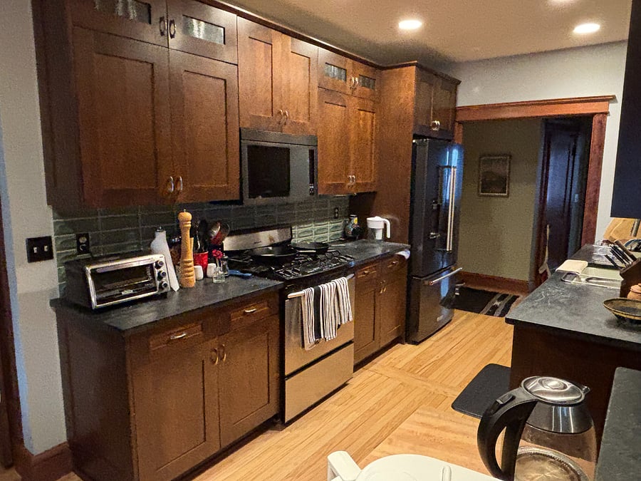 Kitchen w/ gas range and brand-new microwave