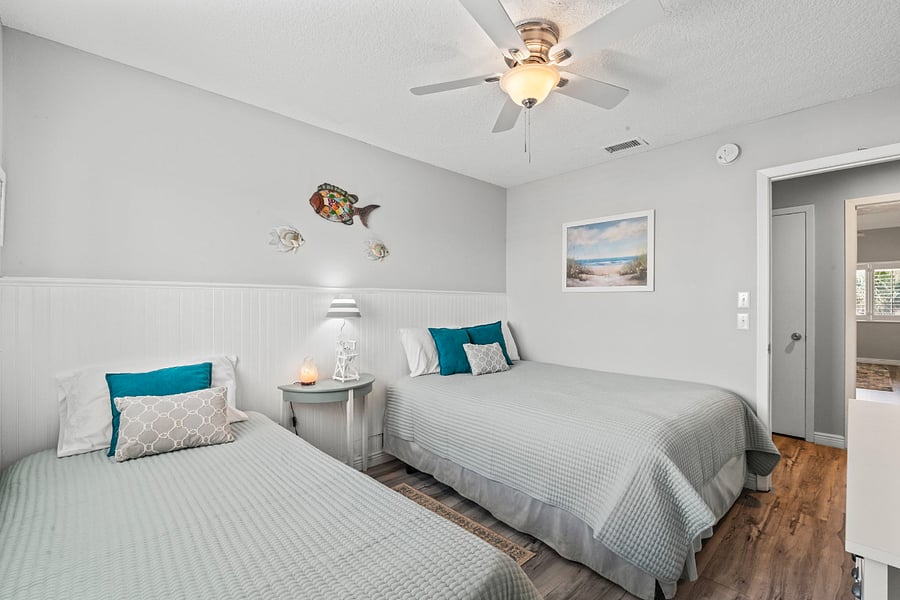 second bedroom with queen and twin bed