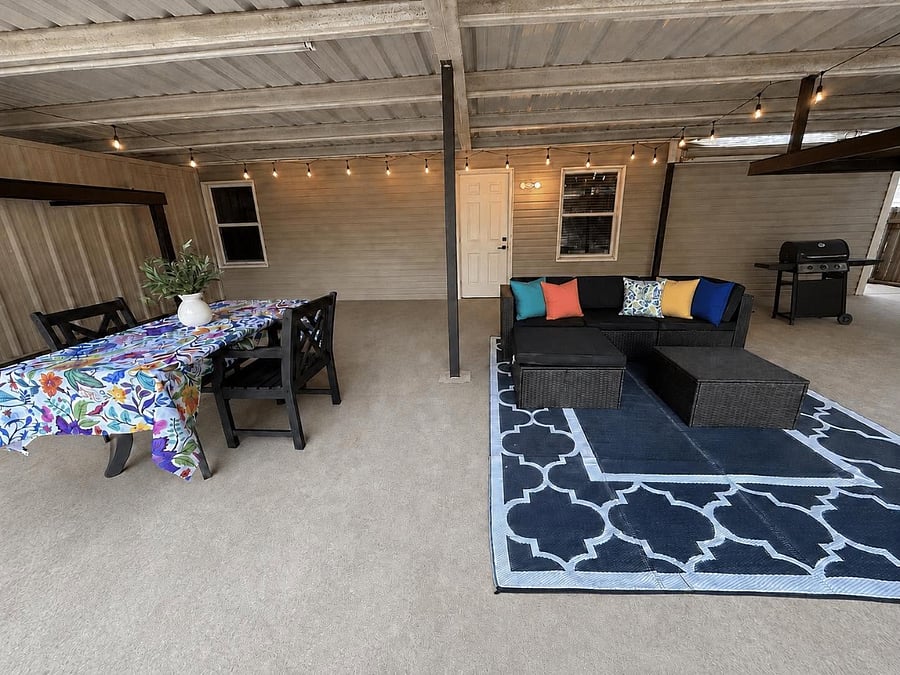 Extra large covered patio with sectional and eating space + grill