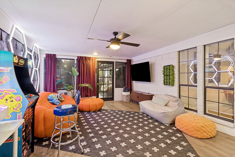 Entertainment & Game Room: A fun, laid-back space with arcade games, a large TV, and comfortable lounge seatingperfect for game nights, movies, or hanging out together.