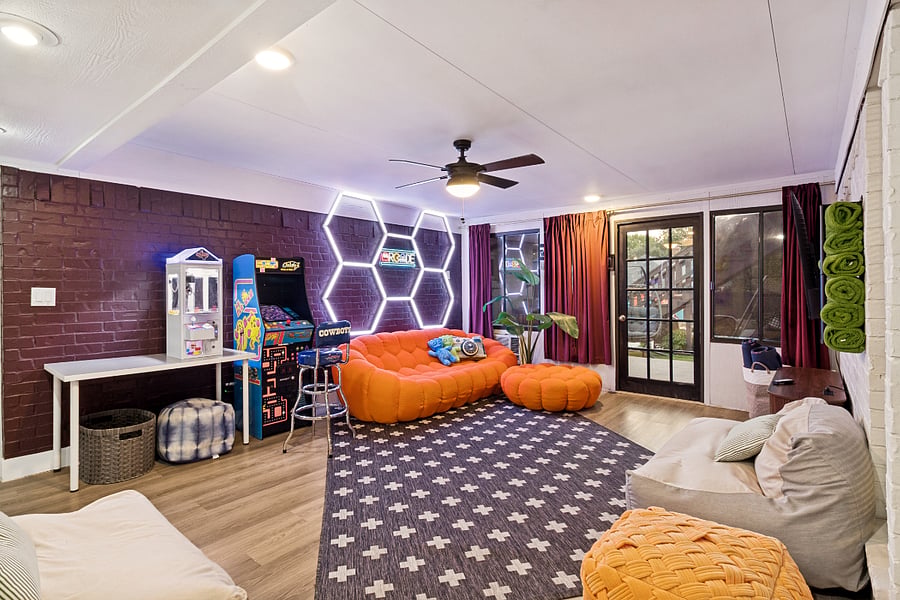 Entertainment & Game Room: A fun, laid-back space with arcade games, a large TV, and comfortable lounge seatingperfect for game nights, movies, or hanging out together.