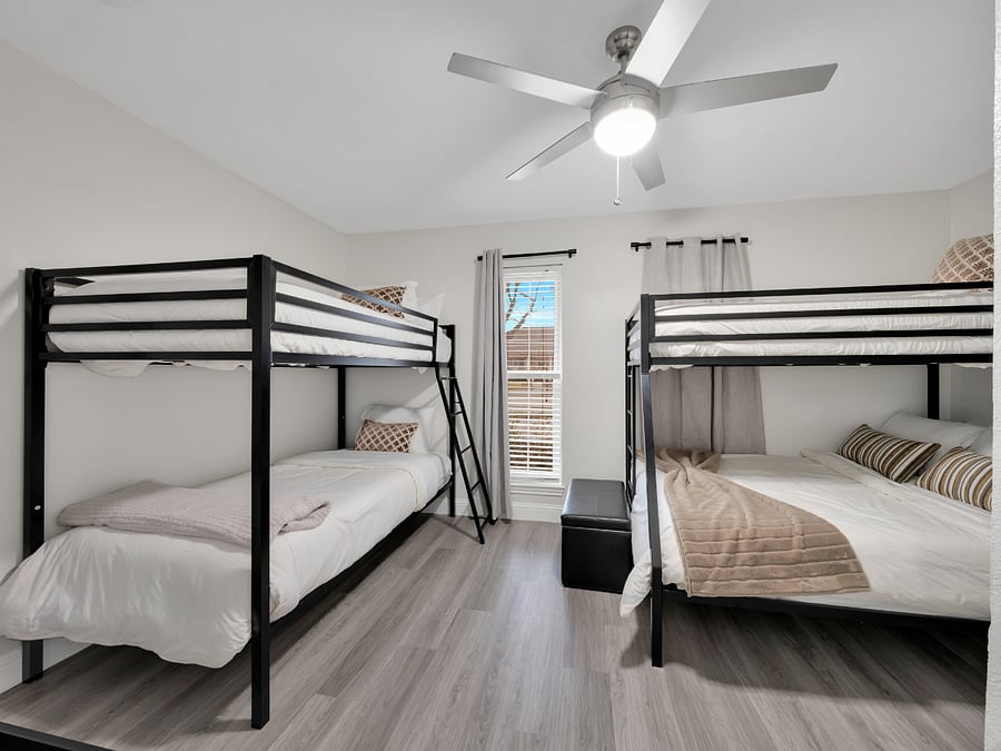 Bunk Room: Spacious bunk room with multiple beds, ideal for shared sleeping arrangements.