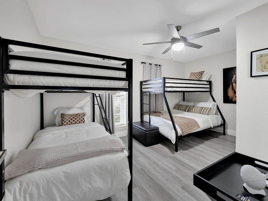 Bunk Room: Spacious bunk room with multiple beds, ideal for shared sleeping arrangements.