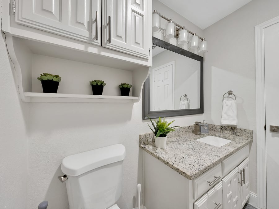 Hallway Bathroom: Full hallway bathroom with a walk-in shower.