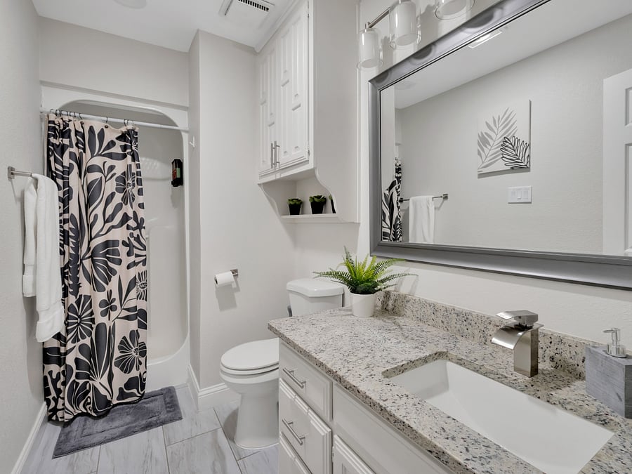 Hallway Bathroom: Full hallway bathroom with a walk-in shower.