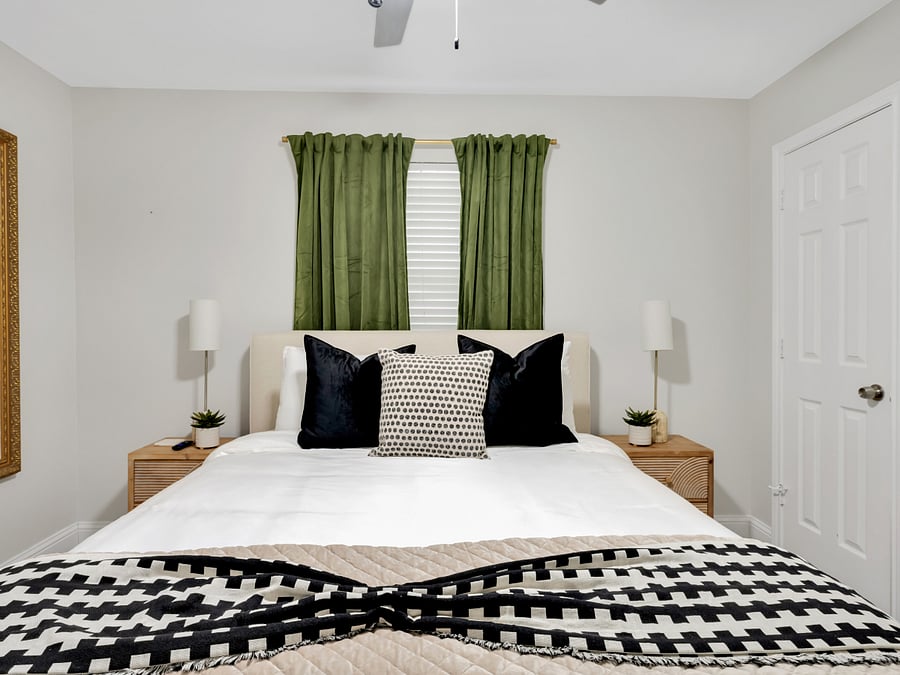 Queen Bedroom: Comfortable queen bedroom with a clean, relaxing setup.