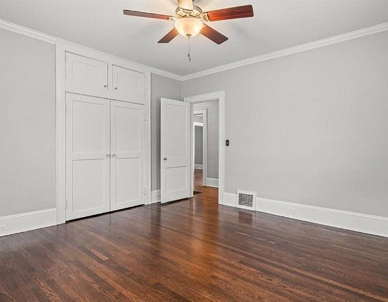 Room shown empty, but has Queen bed, TV, Dresser, Chair, Side Tables, and Closet