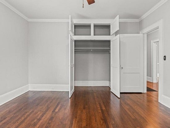 Room shown empty, but has Queen bed, TV, Dresser, Chair, Side Tables, and Closet