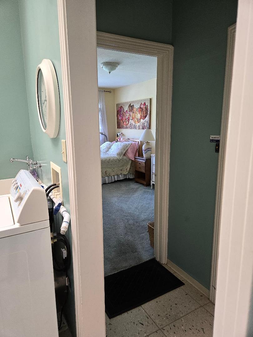 Upon entering semi-private entrance, the bedroom is a few steps to the right