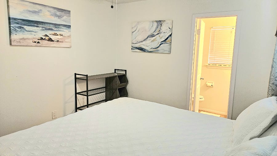 Master bedroom with king size bed.