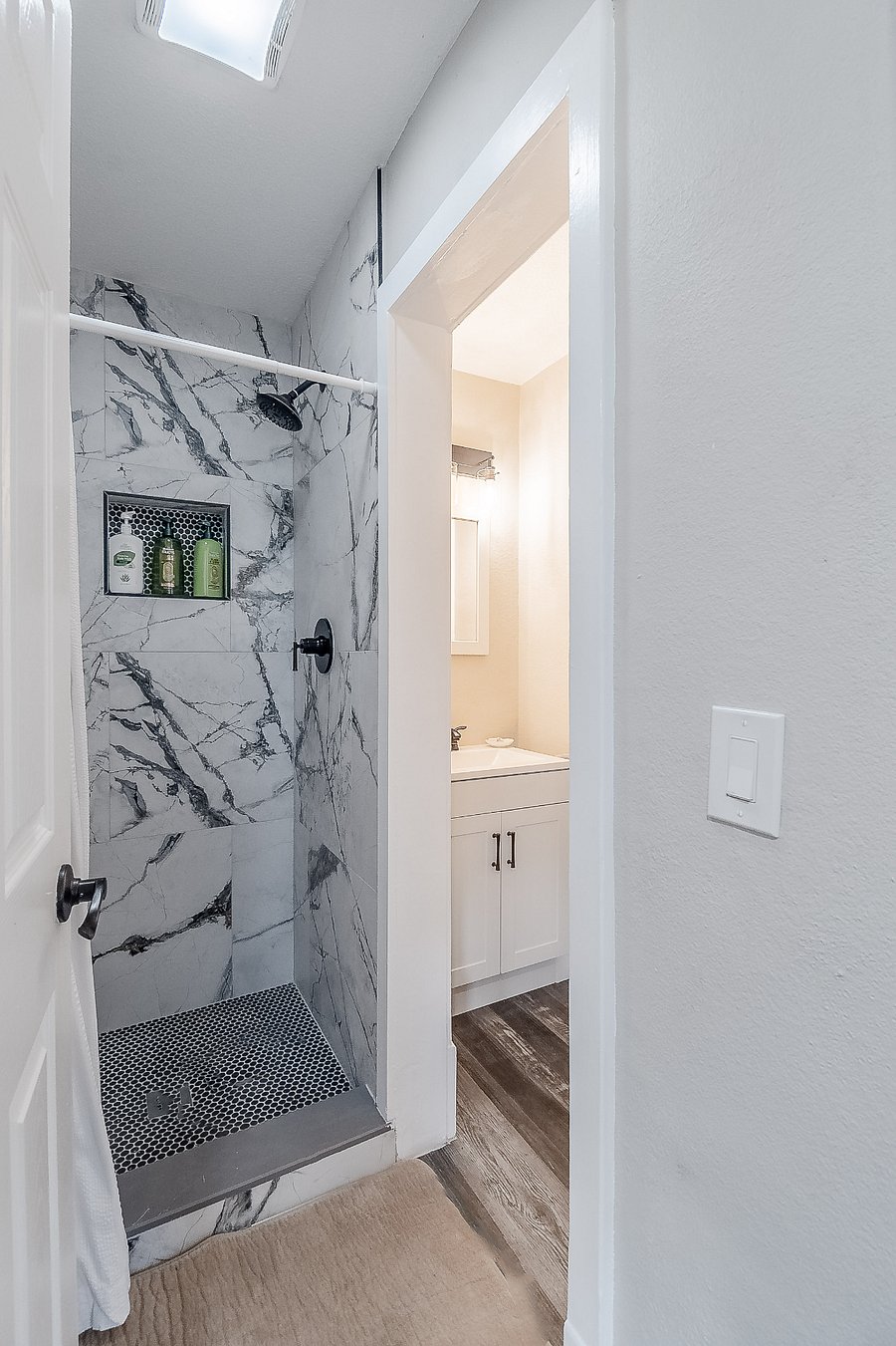 All three bathrooms in the house have been beautifully renovated with walk-in showers.