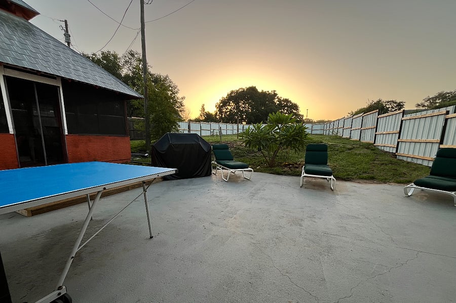 Enjoy Sunrises from the backyard. The space offers Table Tennis (ping pong), Corn hole, gas grill, loungers, screened gazebo and a spacious fenced in yard