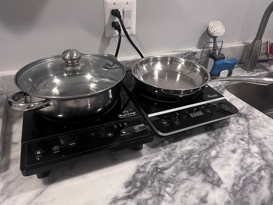 The kitchenette includes two burners that use a regular size pot/pam.