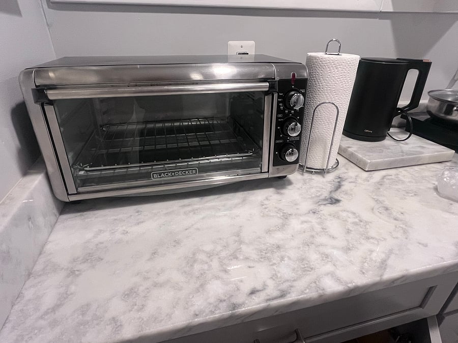 The kitchenette includes a convection microwave oven.