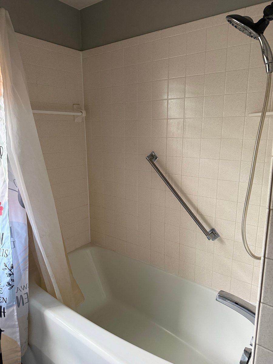 Upstairs shared bathroom-bath tub and shower. Tub has jets