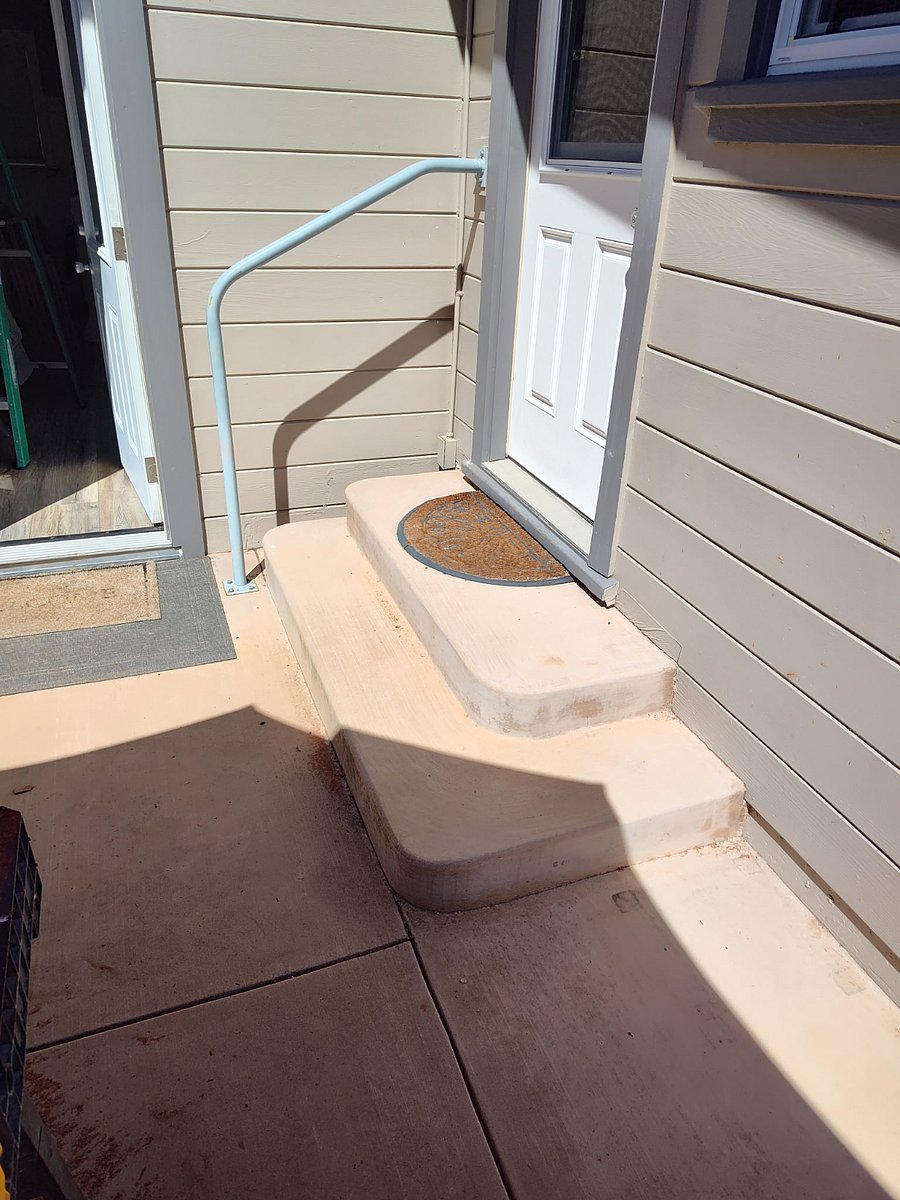 Back step off the kitchen to the backyard and third bedroom.
