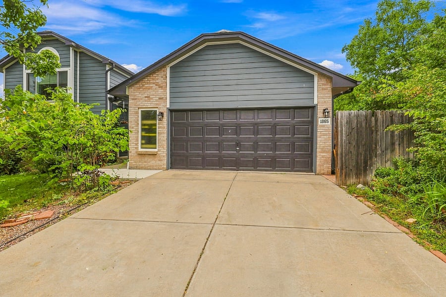 Front of house: spacious single-car garage with extra room