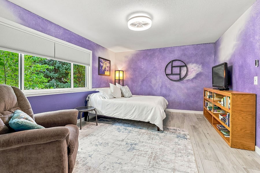 Bedroom 4 (living room floor): a restful retreat with books, a TV, large double closet and room to relax
