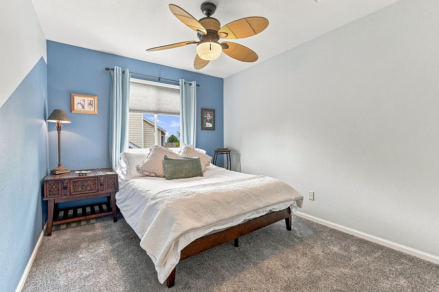 Bedroom 3 (upper floor): Comfortable room queen-size bed and window for light, and a large closet with shelves.