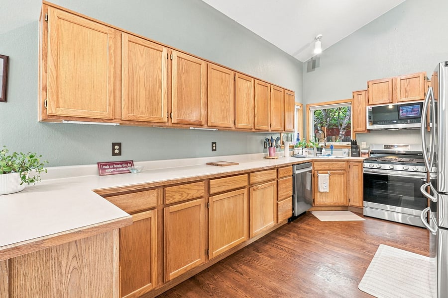 Kitchen (main floor): fully stocked for real cooking, cookware, bakeware, and dishes, plus a Ninja blender, Cuisinart coffee maker, 4-slice toaster, slow cooker, steamer, and teapot. Everything you need for a long stay.