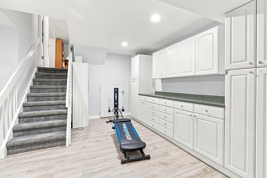 View 6: stairs to lower floor and Workout area (downstairs): a Total Gym lets you exercise every muscle group, with an extensive list of workouts to keep you healthy during your stay.