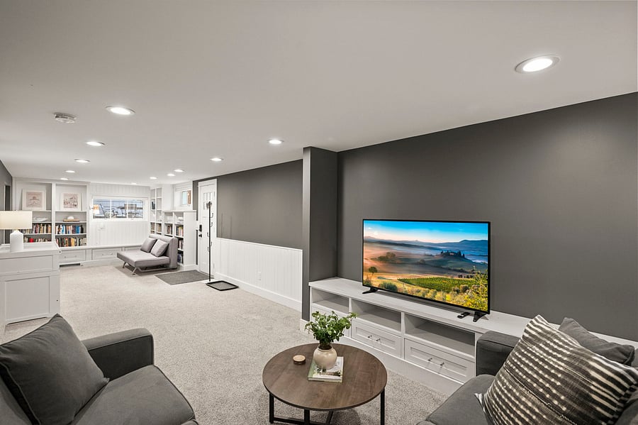 Main room from L-shaped couch by TV looking towards rest of unit.