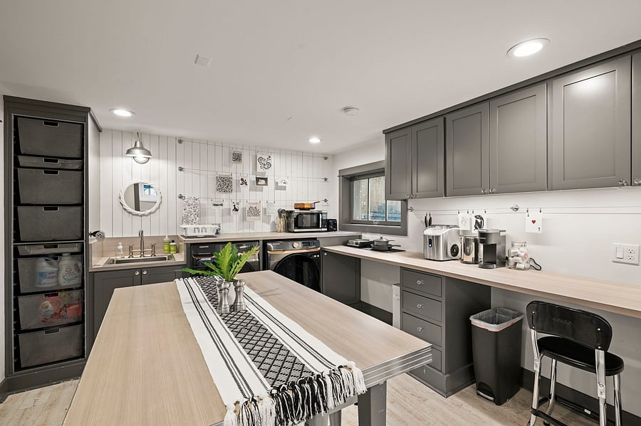 Extended kitchenette work/prep counter with stool seating and extra room for laptop or dining.