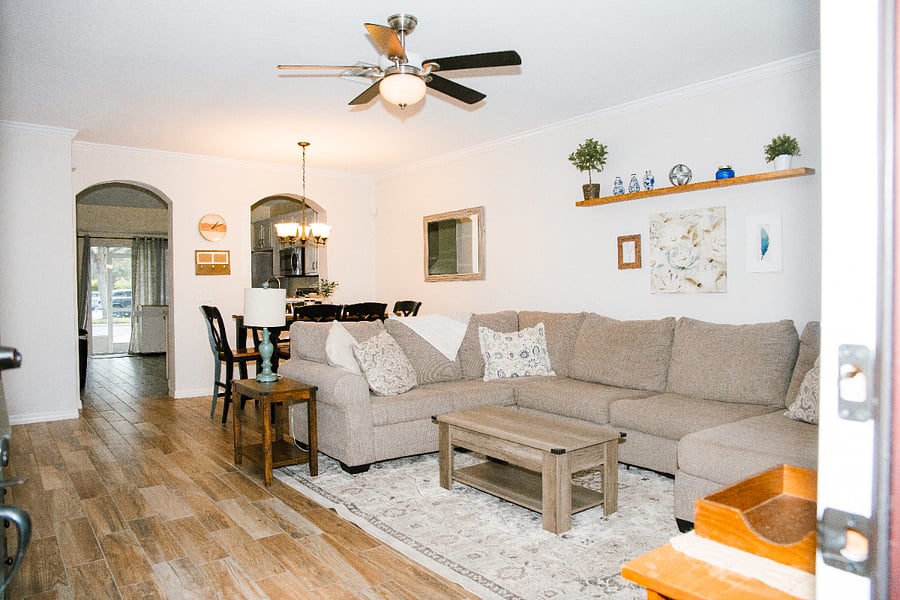 Living Room; Large sectional couch with a lift-top coffee table.