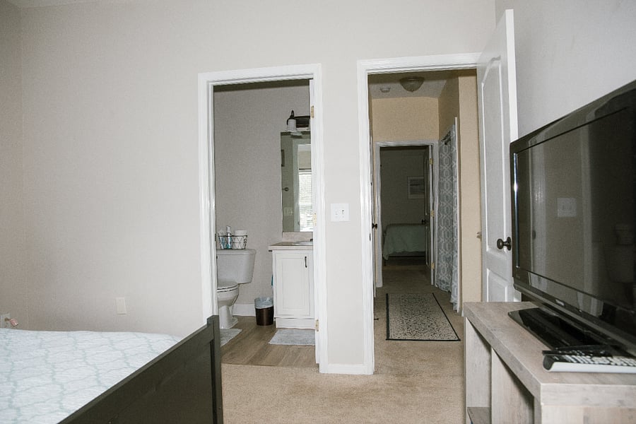 Secondary bedroom; en-suite bathroom and hallway view
