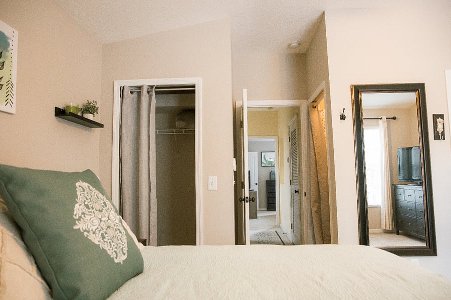Primary bedroom; Double closets and a mounted full-length mirror