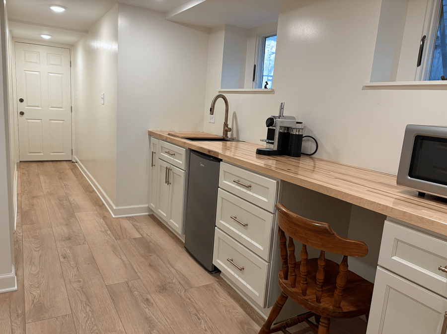 UNIT 1: Kitchenette with a bar size sink 21", microwave, full size fridge, a drink fridge, hot plate and a espresso machine. 