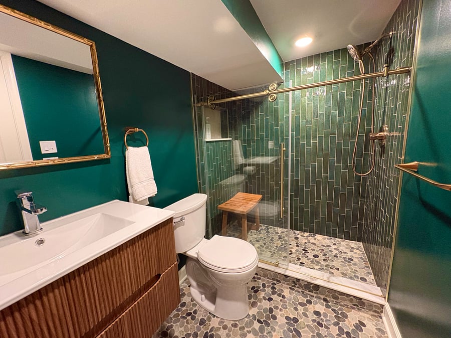 UNIT1: Emerald Full Bathroom with standing shower, toilet and vanity.