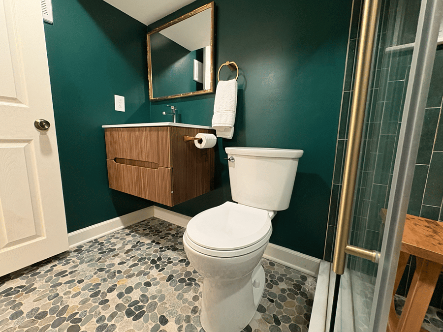 UNIT1: Emerald Full Bathroom with standing shower, toilet and vanity.