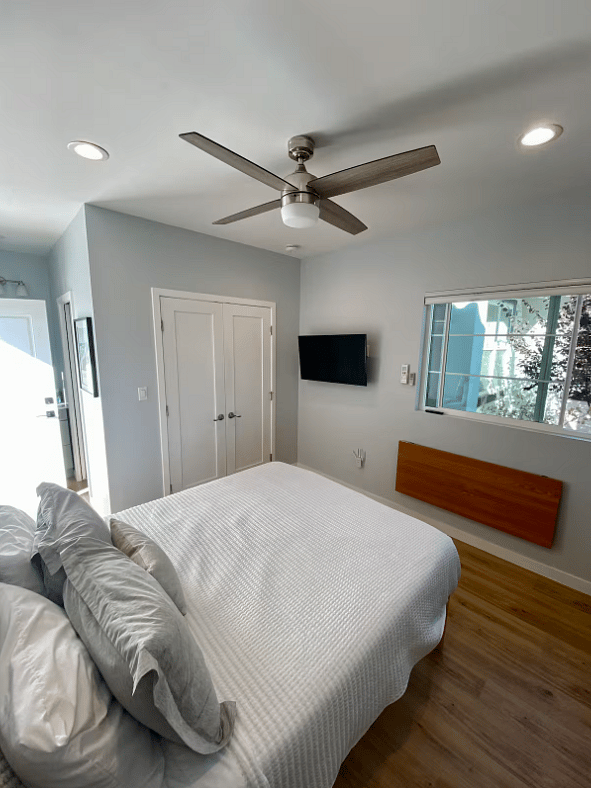 Flat screen TV mounted on wall.