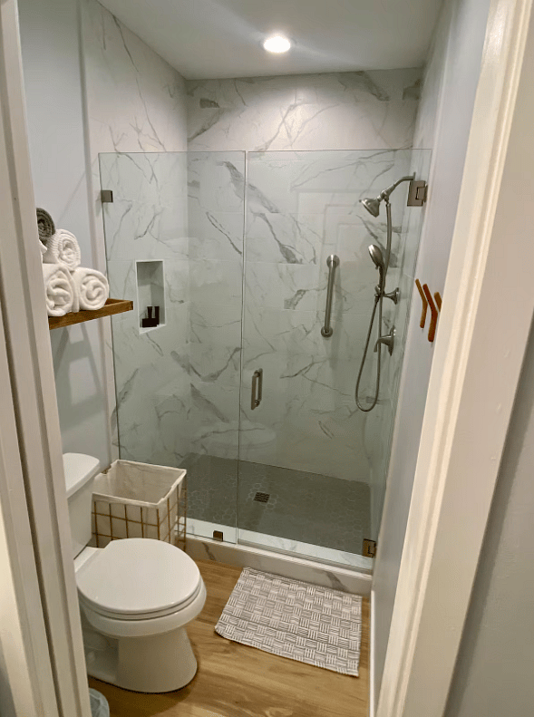 Full shower with glass doors.