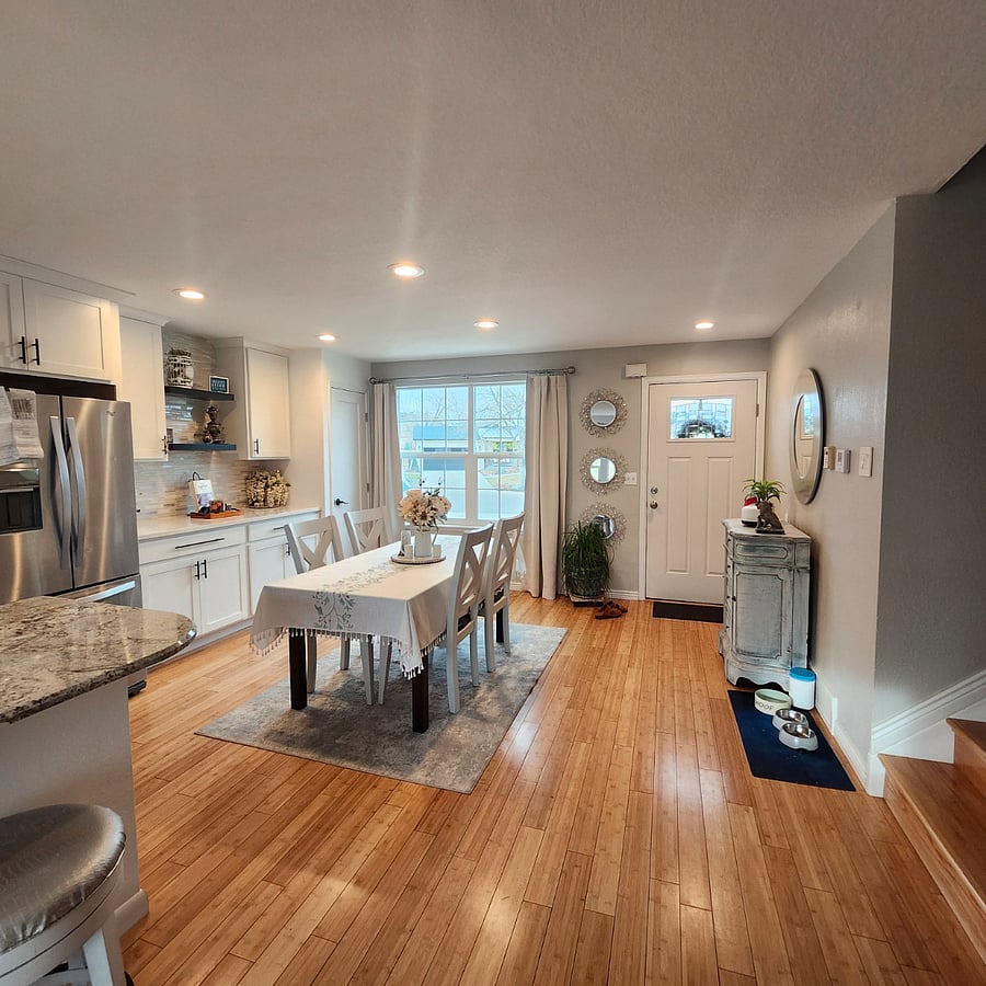 Bright dining space with large windows and plenty of natural light