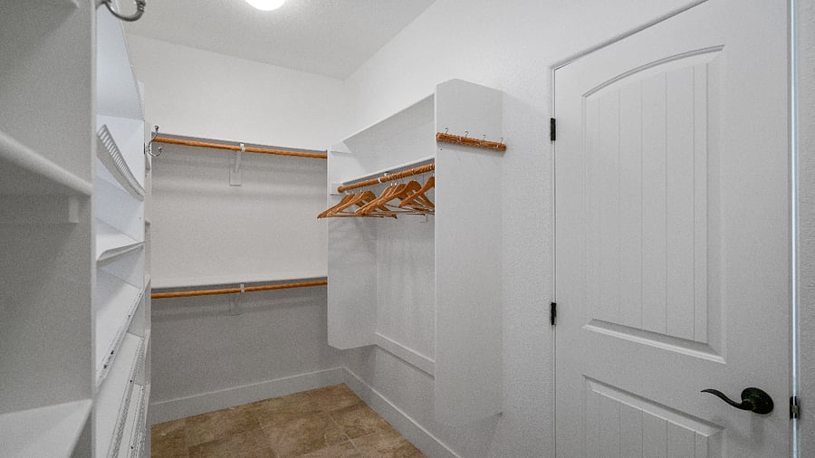 Walk-in closet in primary bedroom