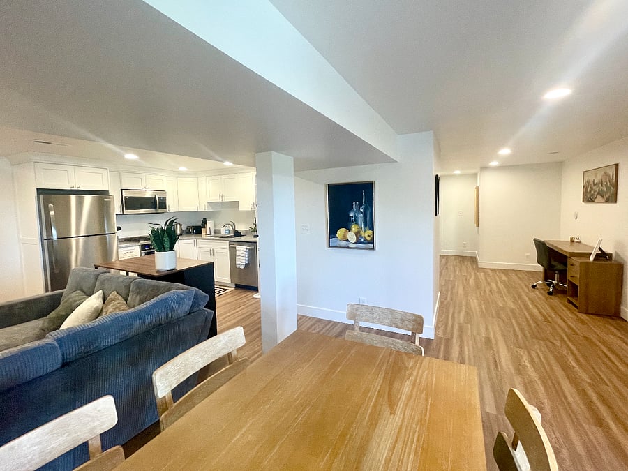 Open living space with kitchen, dining and living room.