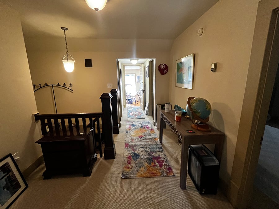 Wide hallway facing towards the kitchen from the living room.
