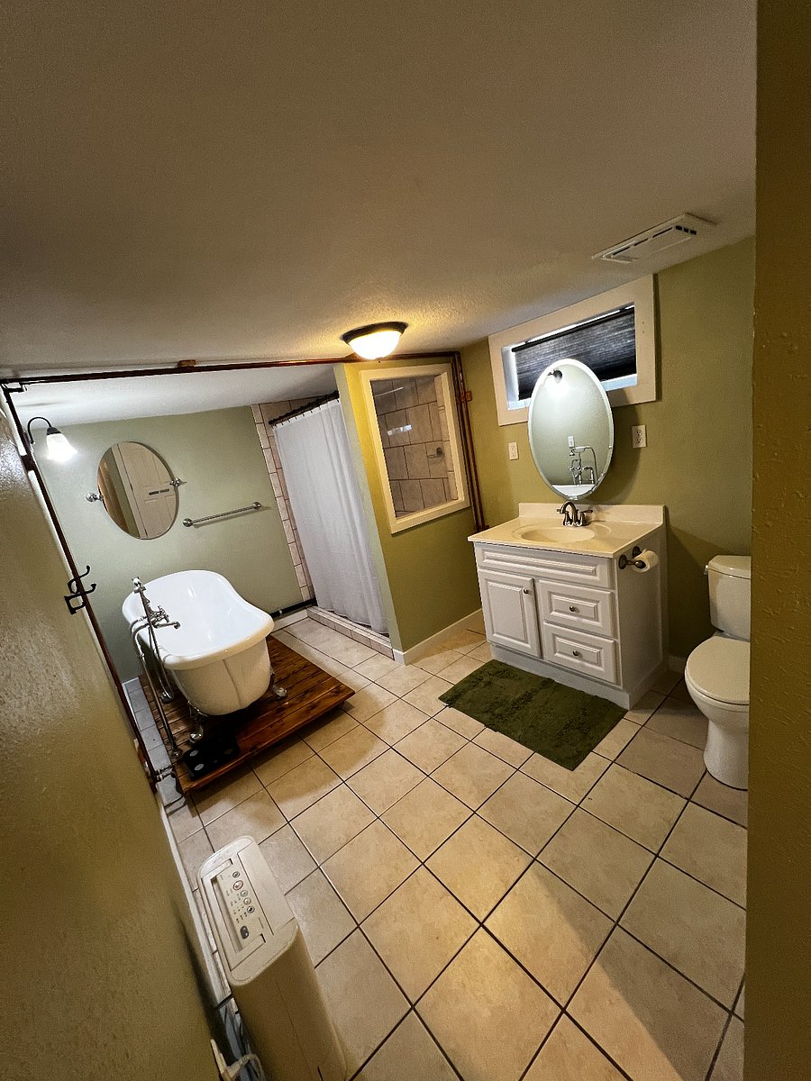 Bathroom with shower and bathtub