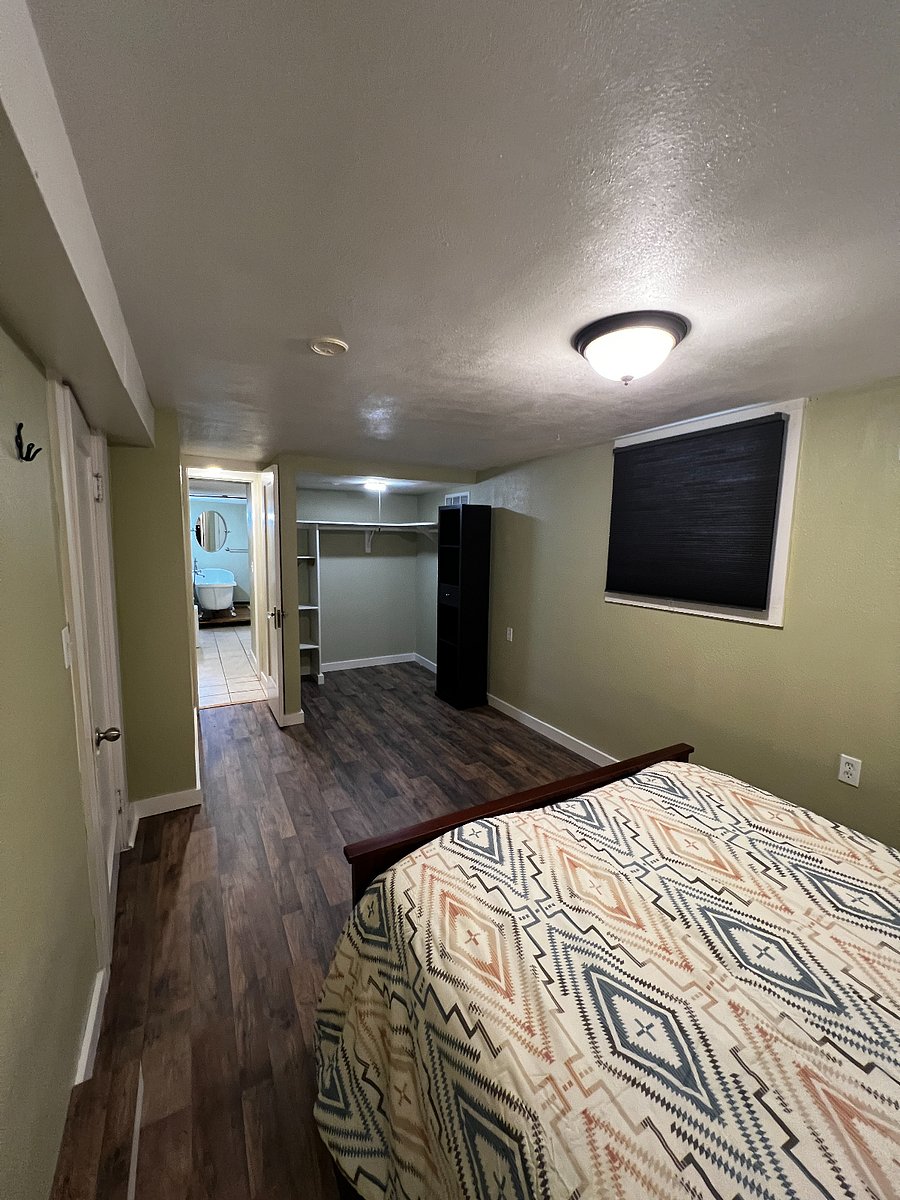 Main bedroom with view of walk-in closet and leading to the bathroom