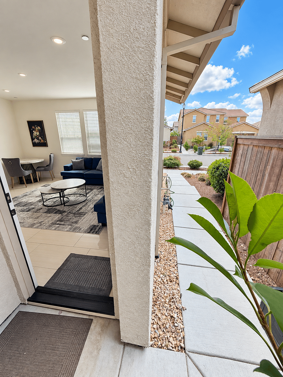 Private entrance with a covered walkway, providing convenient and independent access to the suite.